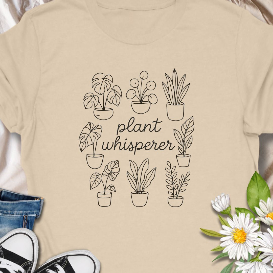 Speak fluent foliage with this "Plant Whisperer" t-shirt – a minimalist, hand-drawn design perfect for indoor plant lovers, proud plant parents, and botanical enthusiasts. A stylish and subtle gift for houseplant collectors and green-thumbed friends.