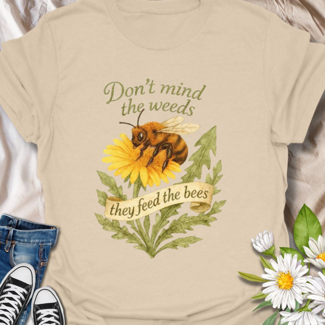 Support pollinators in style with this charming “Don’t Mind the Weeds, They Feed the Bees” t-shirt. Featuring a hand-drawn bee and dandelion artwork, this eco-friendly message tee is perfect for gardeners, nature lovers, and bee advocates who know weeds can be beautiful too.