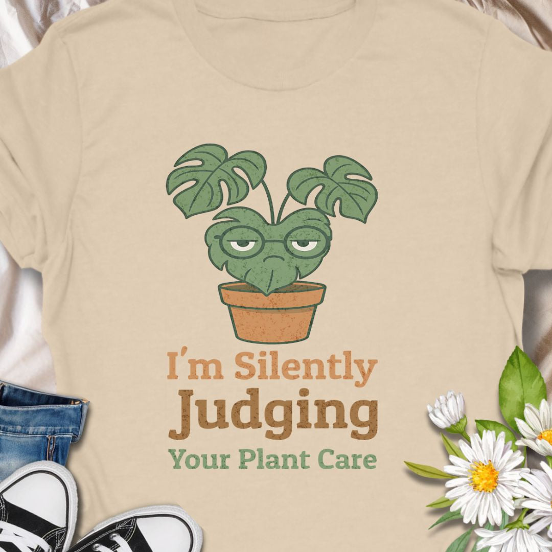 Calling all sassy plant parents – this “I'm Silently Judging Your Plant Care” tee is made for you! Featuring a moody monstera in a pot, it’s perfect for green thumbs who have high standards and a sense of humor. Ideal gift for plant moms, plant dads, and houseplant snobs alike!
