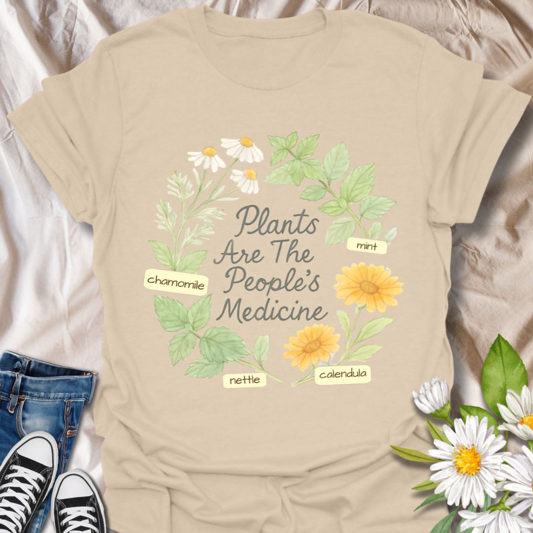Celebrate the healing power of plants with this botanical t-shirt featuring illustrated herbs like chamomile, mint, nettle, and calendula surrounding the message "Plants Are The People's Medicine." Perfect for herbalists, nature lovers, and plant-based wellness advocates, this tee is a beautiful tribute to natural remedies and holistic living.