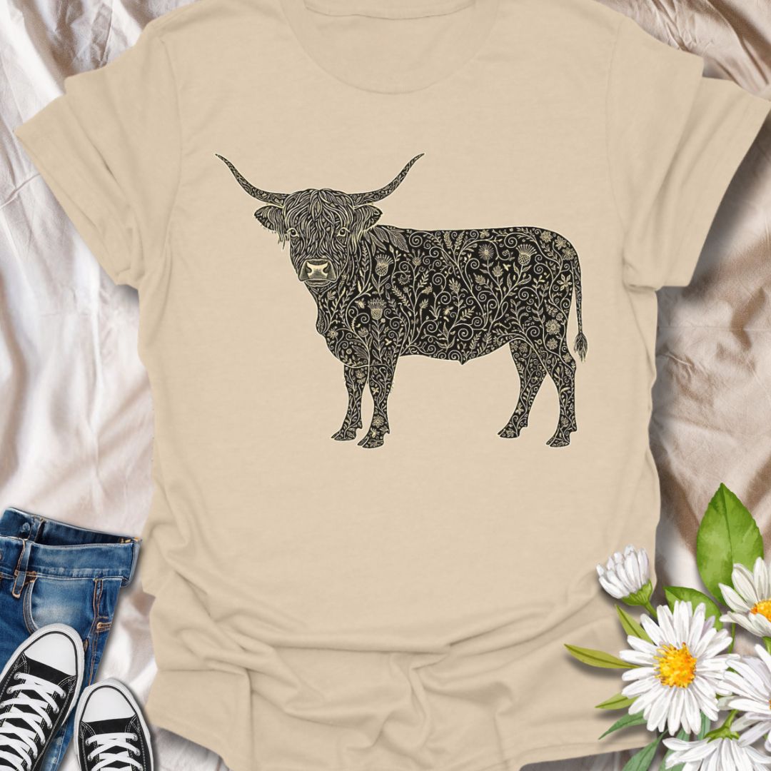 Show off your love for rustic charm and artistic nature with this intricately designed Highland cow graphic t-shirt. Featuring a beautifully detailed floral pattern within the iconic silhouette of a Highland cow, this design is perfect for farm lovers, botanical art fans, and anyone who appreciates country-inspired fashion with a creative twist.