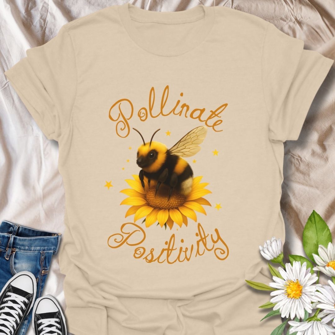 Pollinate Positivity t-shirt featuring a cute bumblebee on a bright sunflower, spreading good vibes and positive energy. Perfect bee lover shirt, nature-inspired graphic tee, gardening gift, or summer aesthetic outfit. Soft, lightweight, and ideal for women, teens, or anyone who loves bees, sunflowers, and inspirational quotes