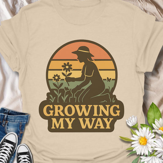Celebrate your love for gardening and independence with this empowering "Growing My Way" t-shirt. Featuring a vintage-style silhouette and floral design, it’s perfect for plant lovers who grow at their own pace. A thoughtful gift for gardeners, homesteaders, and green-thumbed souls.