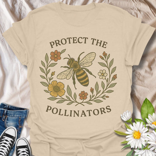 Show your love for nature and sustainability with this eco-friendly graphic t-shirt featuring a detailed bee illustration surrounded by flowers and the message "Protect the Pollinators." Perfect for environmentalists, gardeners, and bee conservation supporters.