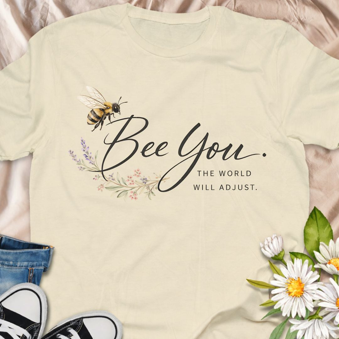 Bee You, the world will adjust. This inspirational bee and botanical t-shirt celebrates self-confidence, authenticity, and nature-led living. A thoughtful gift for bee lovers, plant lovers, and anyone who believes in staying true to themselves.