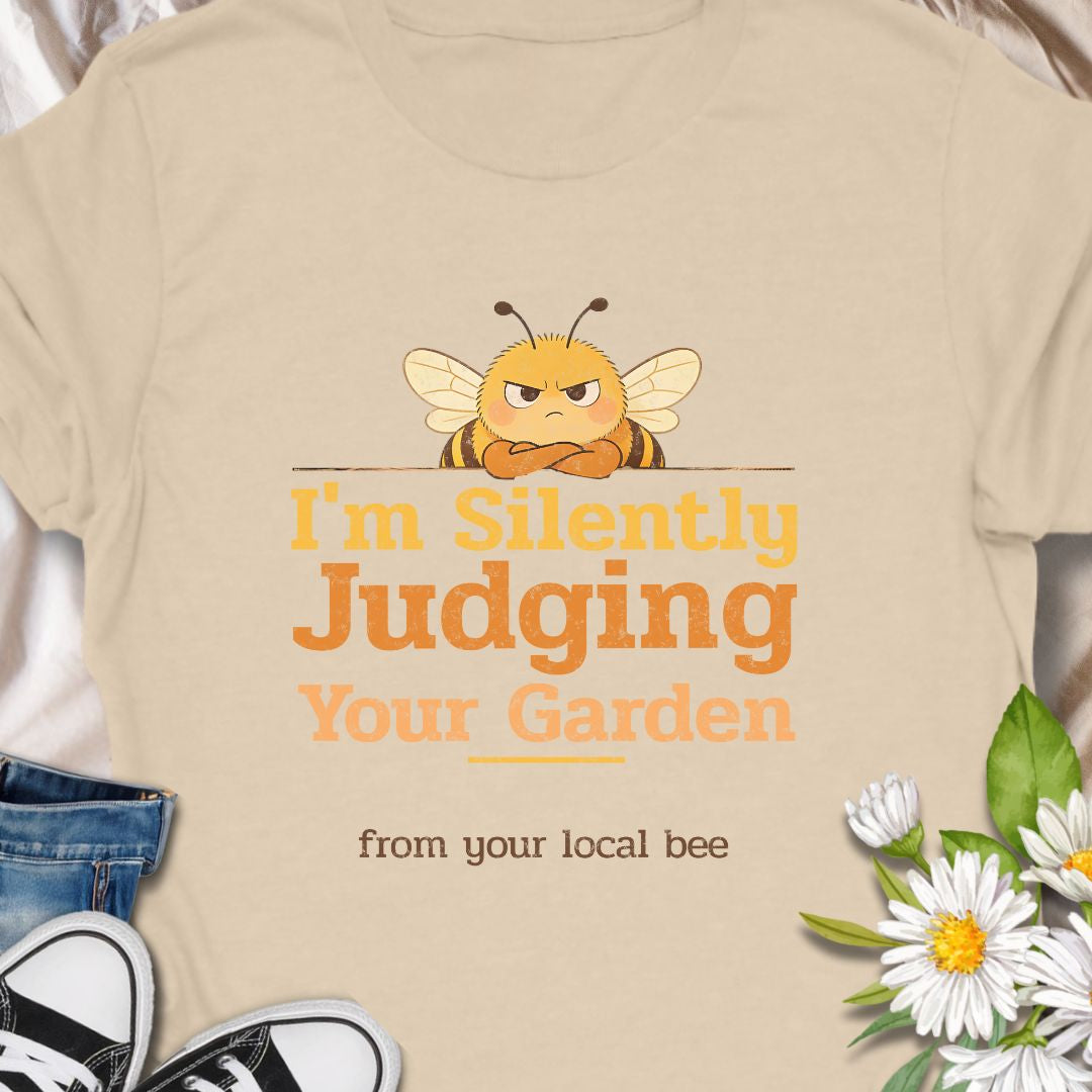 Let your inner bee do the talking with this hilarious “I’m Silently Judging Your Garden” T-shirt featuring a grumpy bee. Perfect for gardeners, plant lovers, and pollinator protectors with a sarcastic sense of humor. A playful gift for bee enthusiasts and backyard botanists alike.