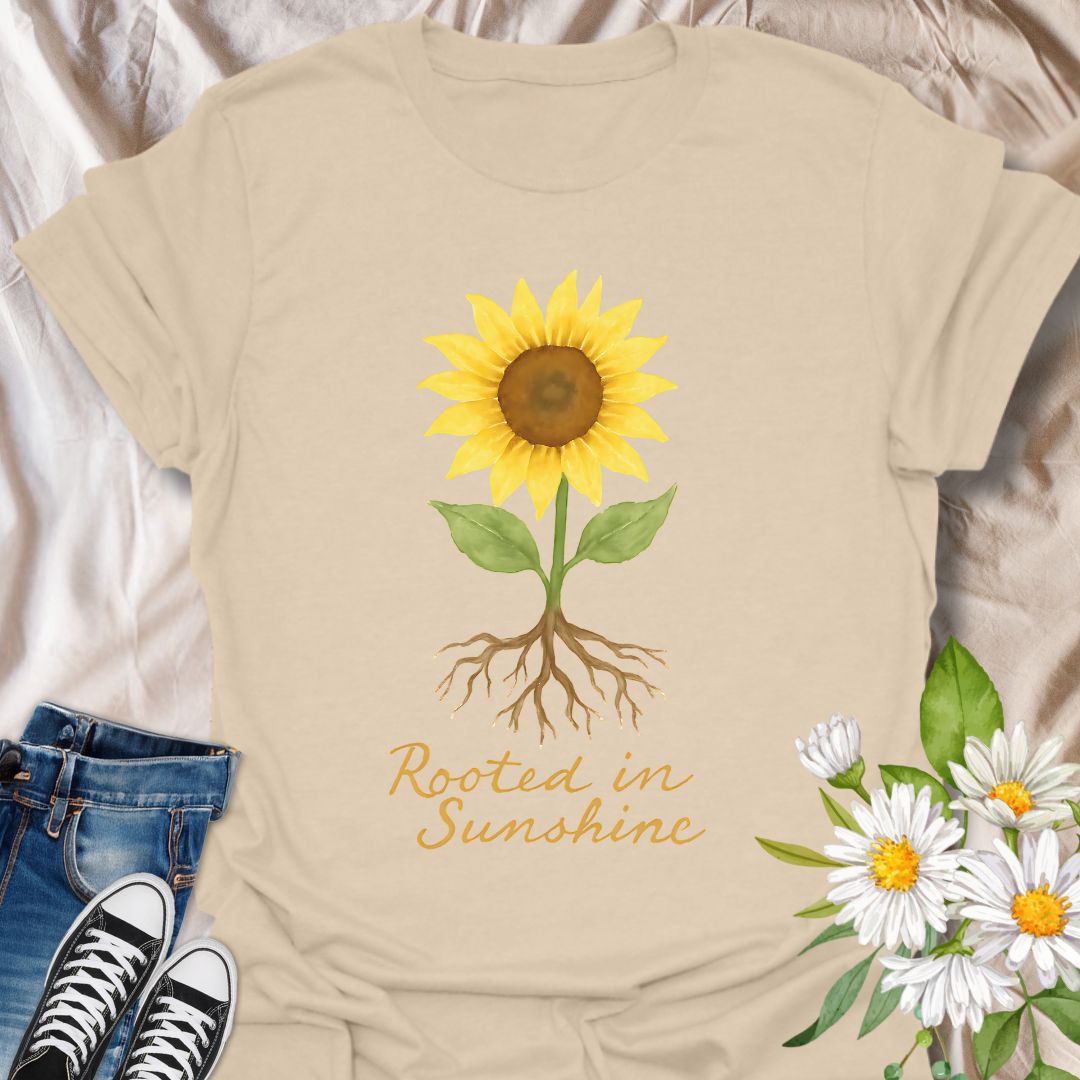 Uplifting sunflower t-shirt with detailed roots and the inspiring phrase ‘Rooted in Sunshine.’ Perfect for nature lovers, gardeners, plant moms, and anyone who finds strength and joy in growth, positivity, and sunshine. A thoughtful gift for self-care, mindfulness, and outdoor enthusiasts.