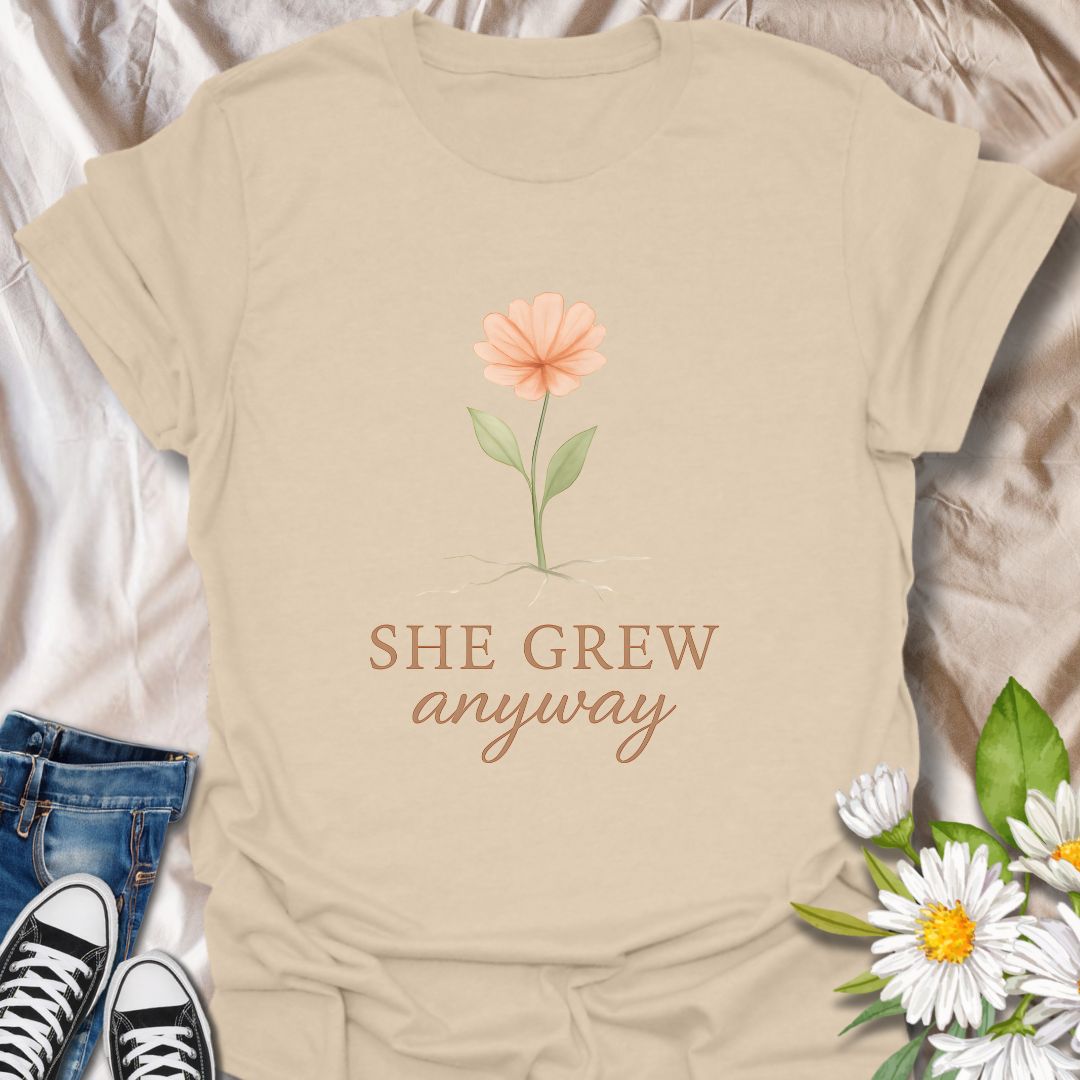 Celebrate resilience and personal growth with the “She Grew Anyway” t-shirt. Featuring a delicate hand-drawn flower with exposed roots, this inspirational design symbolizes strength, healing, and blooming through adversity. Perfect for mental health awareness, self-love, and empowerment, this floral graphic tee makes a meaningful gift for women, plant lovers, and anyone on a journey of growth and self-discovery.