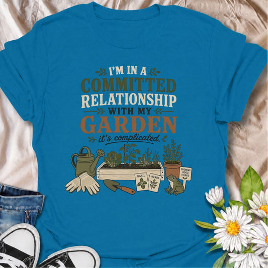 Celebrate your most dependable relationship with this funny gardening T-shirt. Featuring the phrase “I’m in a Committed Relationship With My Garden,” it is perfect for gardeners who would rather spend their time among plants, herbs, and raised beds. A charming gift for garden lovers, plant moms, and backyard growers.