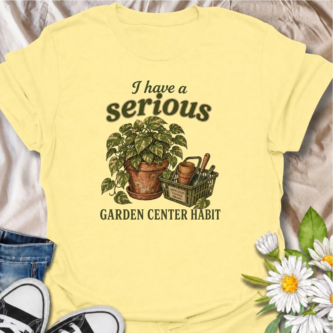 A funny plant T-shirt for anyone who treats a trip to the garden center like a completely normal weekly habit. Featuring a leafy houseplant, terracotta pots, and a basket of gardening tools, this design is perfect for plant parents and nursery regulars. The phrase “I Have a Serious Garden Center Habit” captures the familiar problem of going in for one thing and coming home with another plant. It makes a great gift for houseplant lovers, indoor gardeners, and anyone who can never resist a nursery visit. Idea