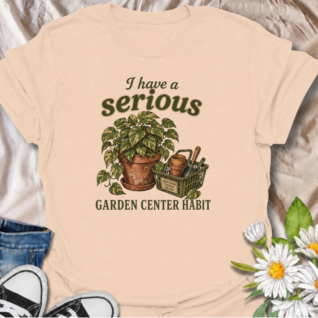 A funny plant T-shirt for anyone who treats a trip to the garden center like a completely normal weekly habit. Featuring a leafy houseplant, terracotta pots, and a basket of gardening tools, this design is perfect for plant parents and nursery regulars. The phrase “I Have a Serious Garden Center Habit” captures the familiar problem of going in for one thing and coming home with another plant. It makes a great gift for houseplant lovers, indoor gardeners, and anyone who can never resist a nursery visit. Idea