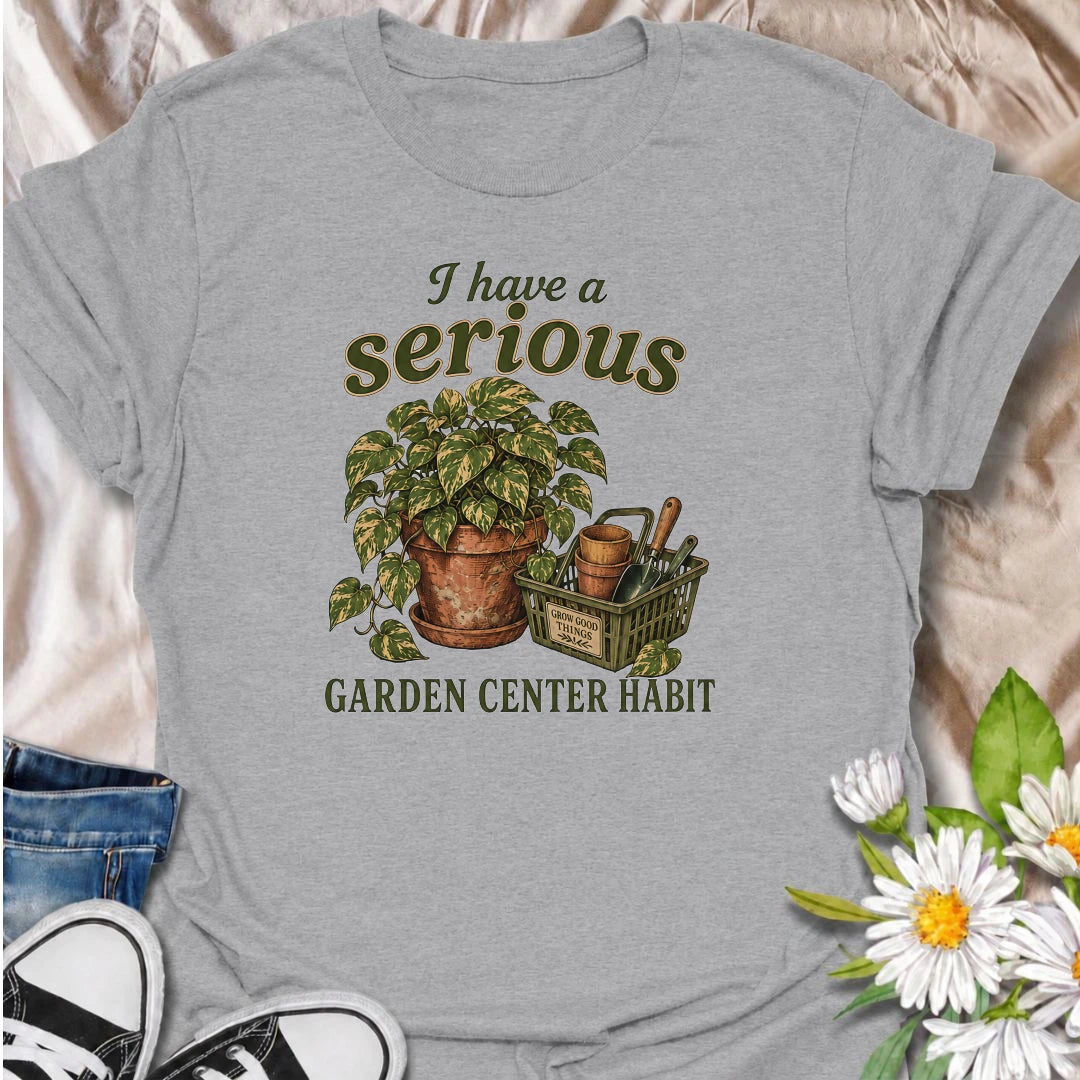 A funny plant T-shirt for anyone who treats a trip to the garden center like a completely normal weekly habit. Featuring a leafy houseplant, terracotta pots, and a basket of gardening tools, this design is perfect for plant parents and nursery regulars. The phrase “I Have a Serious Garden Center Habit” captures the familiar problem of going in for one thing and coming home with another plant. It makes a great gift for houseplant lovers, indoor gardeners, and anyone who can never resist a nursery visit. Idea