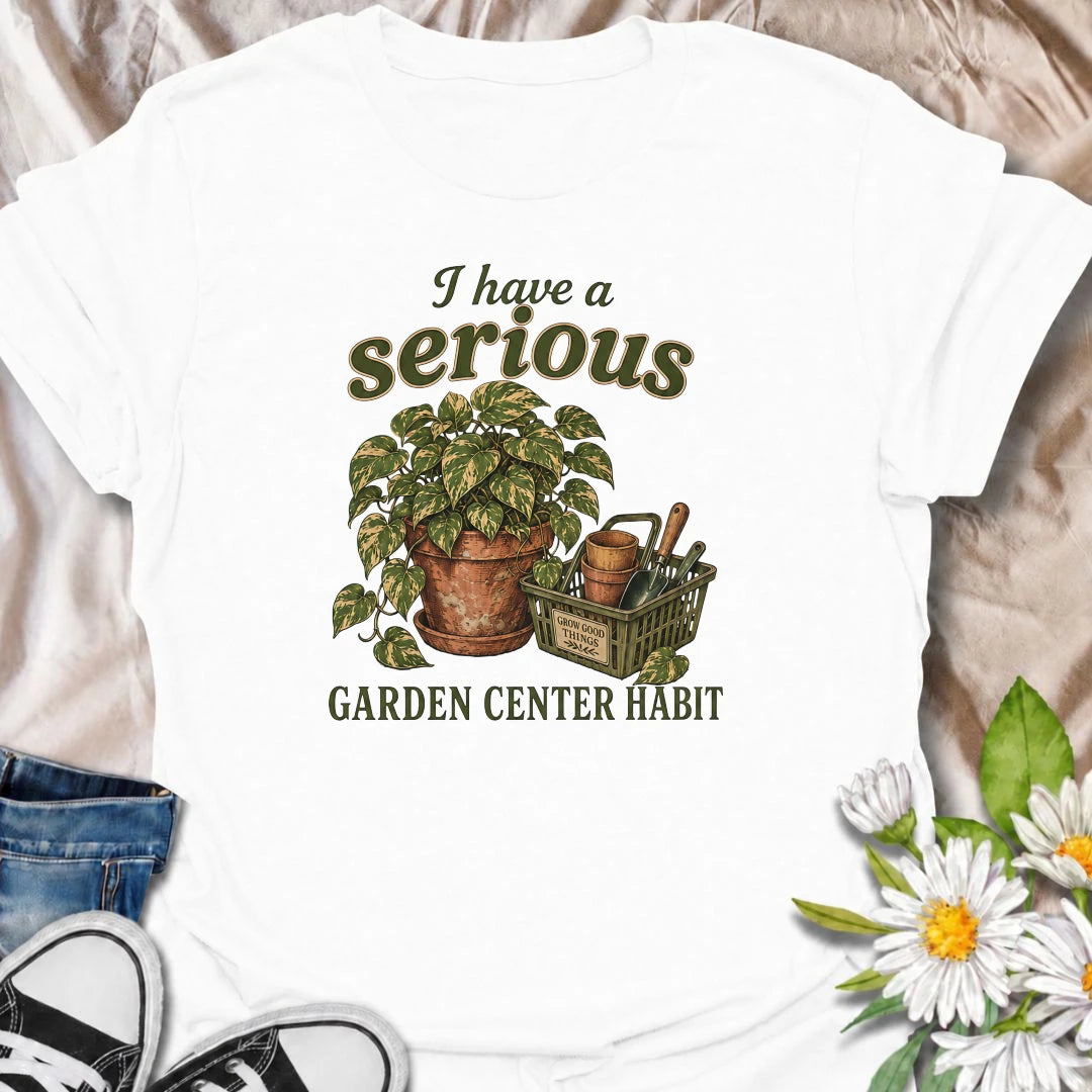 A funny plant T-shirt for anyone who treats a trip to the garden center like a completely normal weekly habit. Featuring a leafy houseplant, terracotta pots, and a basket of gardening tools, this design is perfect for plant parents and nursery regulars. The phrase “I Have a Serious Garden Center Habit” captures the familiar problem of going in for one thing and coming home with another plant. It makes a great gift for houseplant lovers, indoor gardeners, and anyone who can never resist a nursery visit. Idea