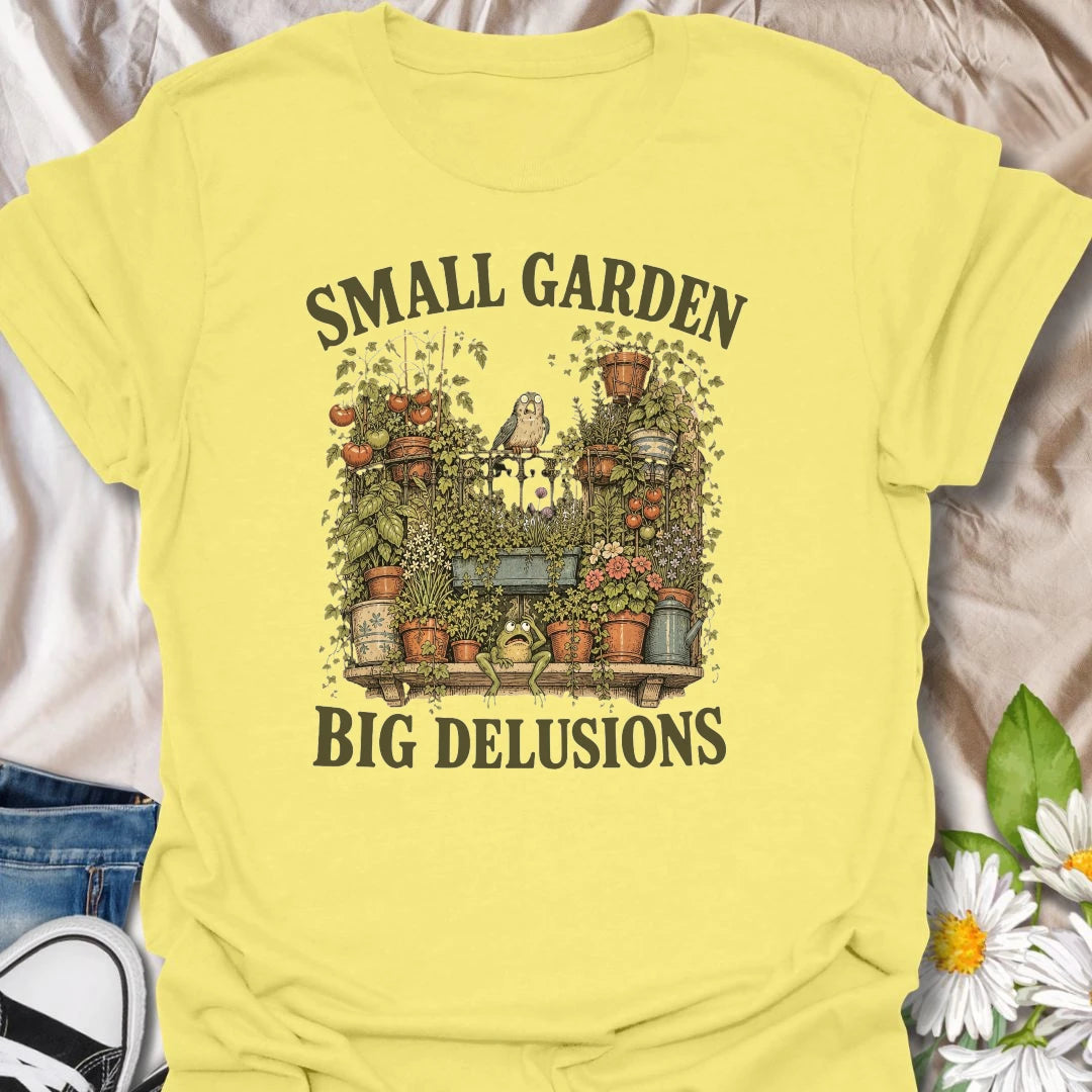 This Small Garden Big Delusions t-shirt is perfect for gardeners who believe every tiny patio, balcony, porch, or backyard can become a full botanical paradise. Featuring an overflowing container garden with tomatoes, flowers, potted plants, a frog, and a tiny bird, this funny gardening design is great for plant lovers, small-space gardeners, balcony growers, and anyone with big garden dreams.
