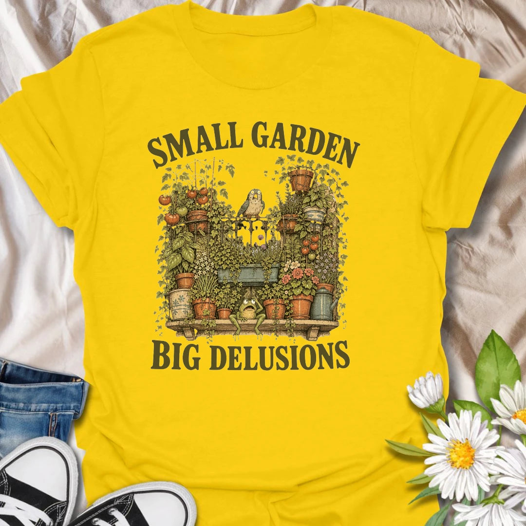 This Small Garden Big Delusions t-shirt is perfect for gardeners who believe every tiny patio, balcony, porch, or backyard can become a full botanical paradise. Featuring an overflowing container garden with tomatoes, flowers, potted plants, a frog, and a tiny bird, this funny gardening design is great for plant lovers, small-space gardeners, balcony growers, and anyone with big garden dreams.