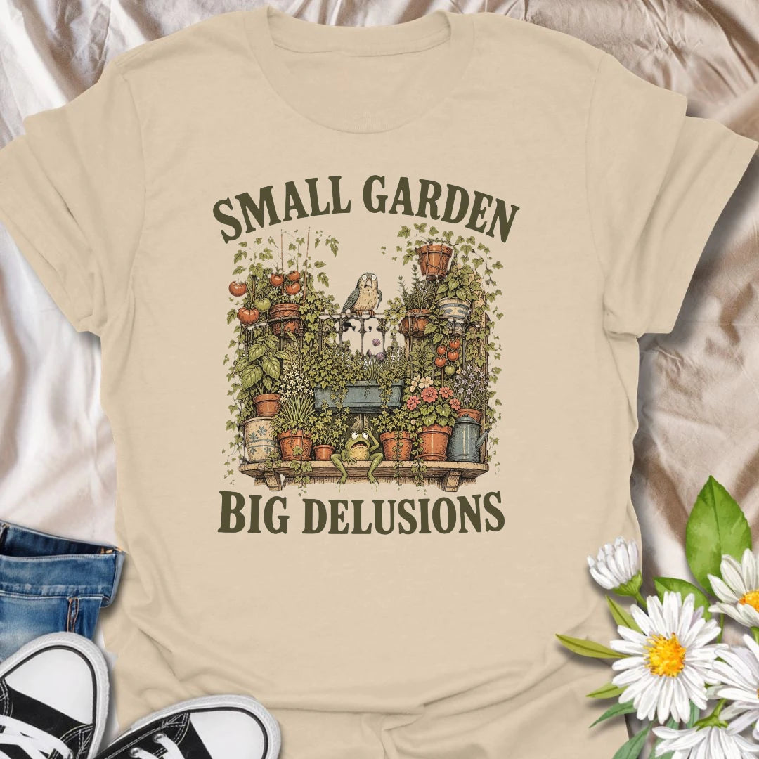 This Small Garden Big Delusions t-shirt is perfect for gardeners who believe every tiny patio, balcony, porch, or backyard can become a full botanical paradise. Featuring an overflowing container garden with tomatoes, flowers, potted plants, a frog, and a tiny bird, this funny gardening design is great for plant lovers, small-space gardeners, balcony growers, and anyone with big garden dreams.