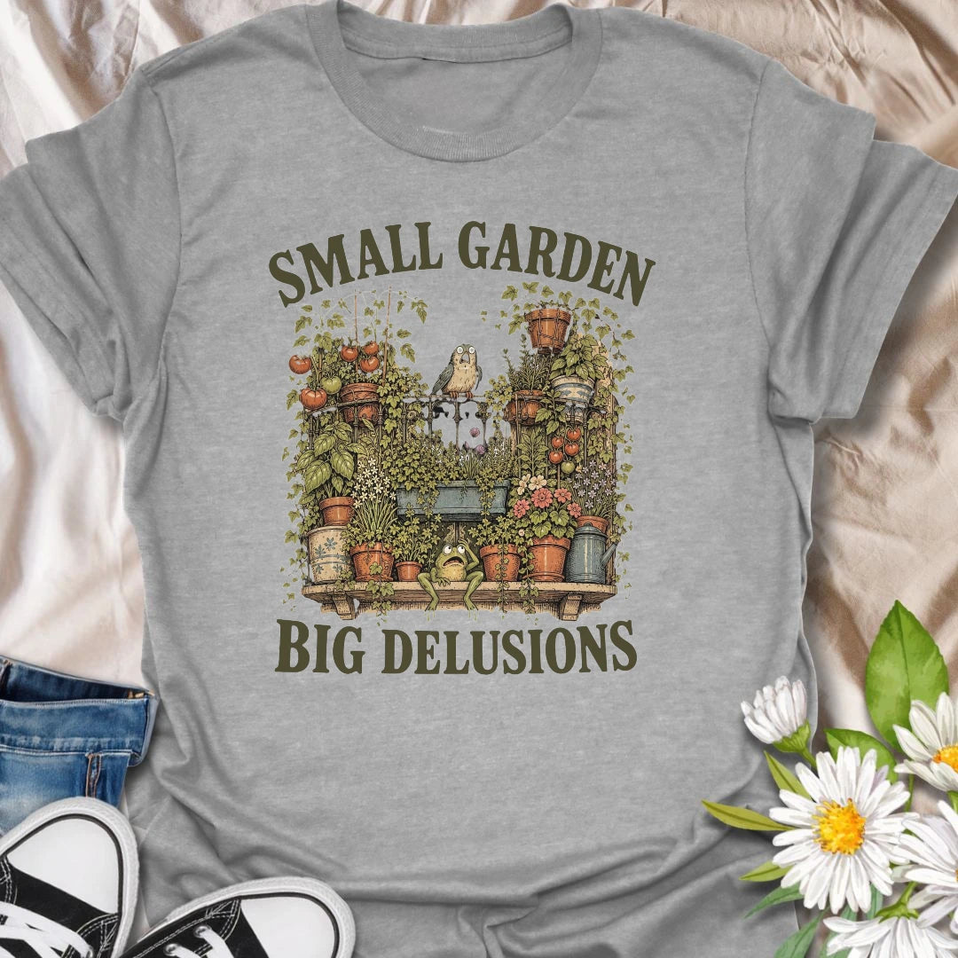This Small Garden Big Delusions t-shirt is perfect for gardeners who believe every tiny patio, balcony, porch, or backyard can become a full botanical paradise. Featuring an overflowing container garden with tomatoes, flowers, potted plants, a frog, and a tiny bird, this funny gardening design is great for plant lovers, small-space gardeners, balcony growers, and anyone with big garden dreams.