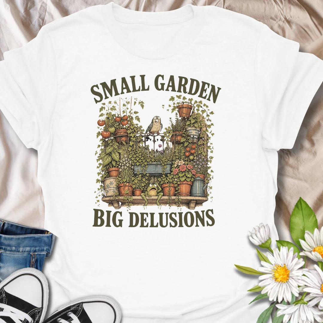 This Small Garden Big Delusions t-shirt is perfect for gardeners who believe every tiny patio, balcony, porch, or backyard can become a full botanical paradise. Featuring an overflowing container garden with tomatoes, flowers, potted plants, a frog, and a tiny bird, this funny gardening design is great for plant lovers, small-space gardeners, balcony growers, and anyone with big garden dreams.