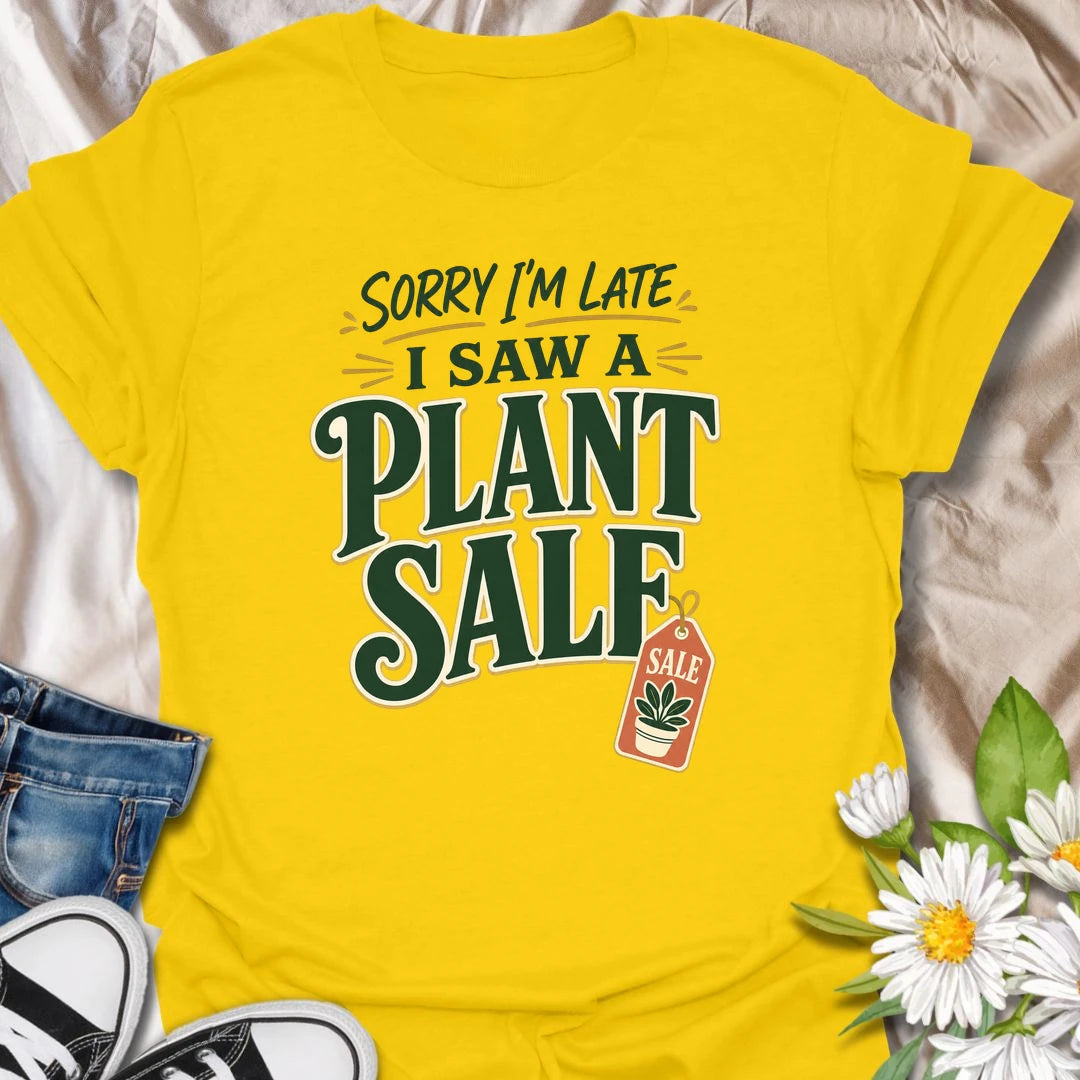 Plant Sale t-shirt for anyone who cannot be trusted around discounted greenery.
The bold retro text and sale tag design make this a funny choice for houseplant shoppers and garden center regulars.
It is perfect for plant moms, plant collectors, and indoor gardeners who are always late because they saw another plant.
A fun gift for plant lovers who know a plant sale is a perfectly valid reason to change plans.