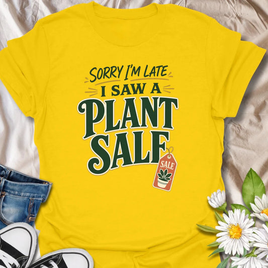 Plant Sale t-shirt for anyone who cannot be trusted around discounted greenery.
The bold retro text and sale tag design make this a funny choice for houseplant shoppers and garden center regulars.
It is perfect for plant moms, plant collectors, and indoor gardeners who are always late because they saw another plant.
A fun gift for plant lovers who know a plant sale is a perfectly valid reason to change plans.