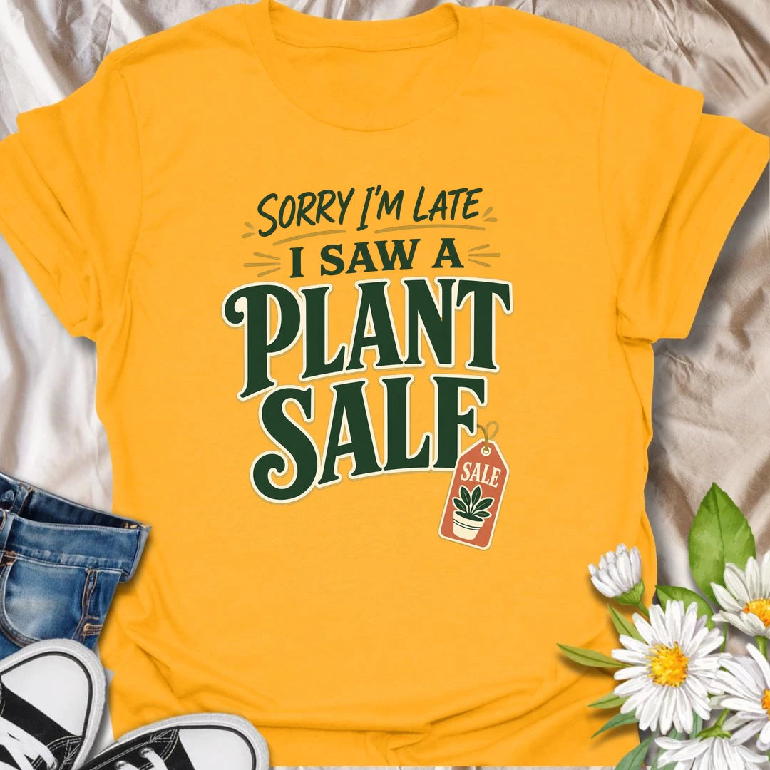 Plant Sale t-shirt for anyone who cannot be trusted around discounted greenery.
The bold retro text and sale tag design make this a funny choice for houseplant shoppers and garden center regulars.
It is perfect for plant moms, plant collectors, and indoor gardeners who are always late because they saw another plant.
A fun gift for plant lovers who know a plant sale is a perfectly valid reason to change plans.