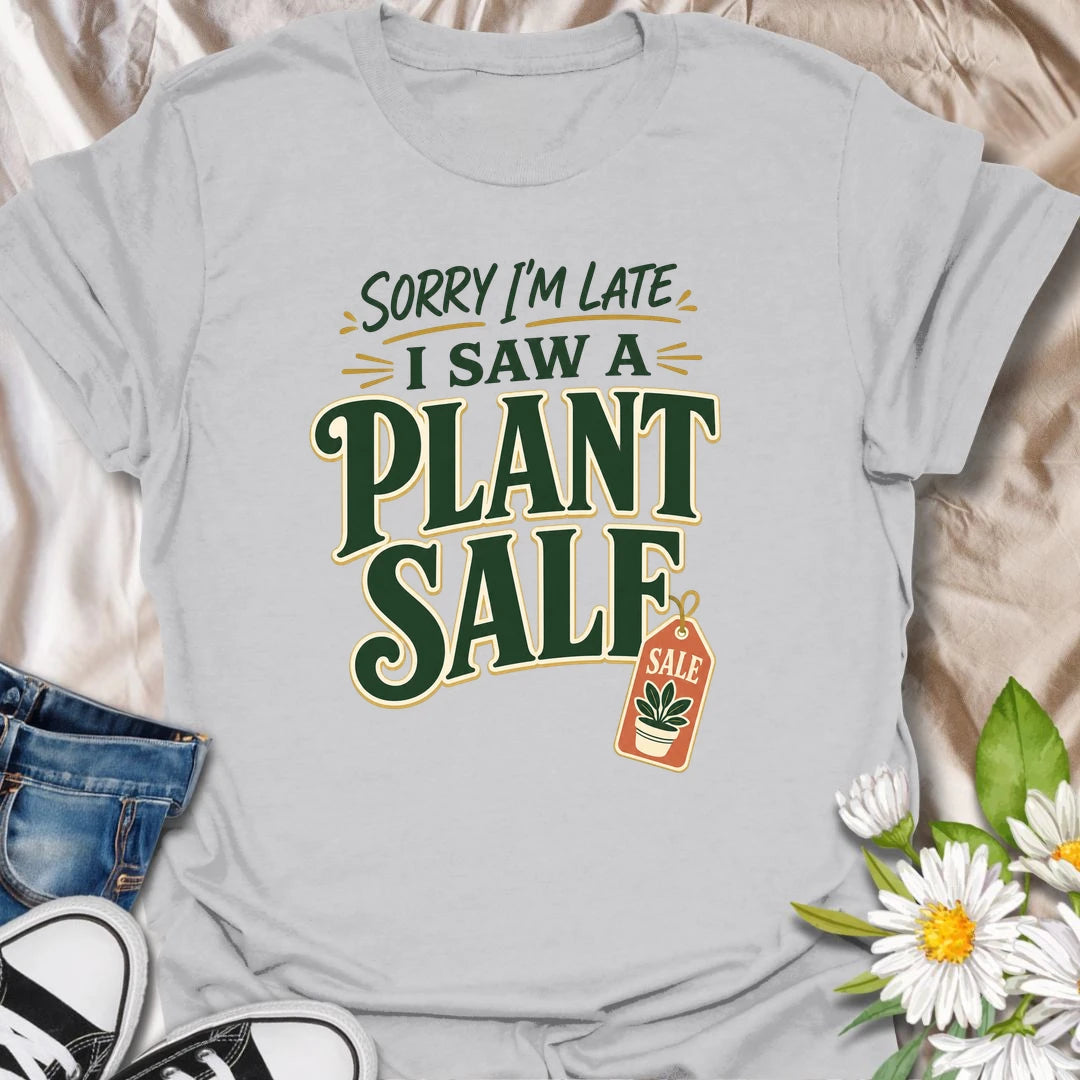Plant Sale t-shirt for anyone who cannot be trusted around discounted greenery.
The bold retro text and sale tag design make this a funny choice for houseplant shoppers and garden center regulars.
It is perfect for plant moms, plant collectors, and indoor gardeners who are always late because they saw another plant.
A fun gift for plant lovers who know a plant sale is a perfectly valid reason to change plans.