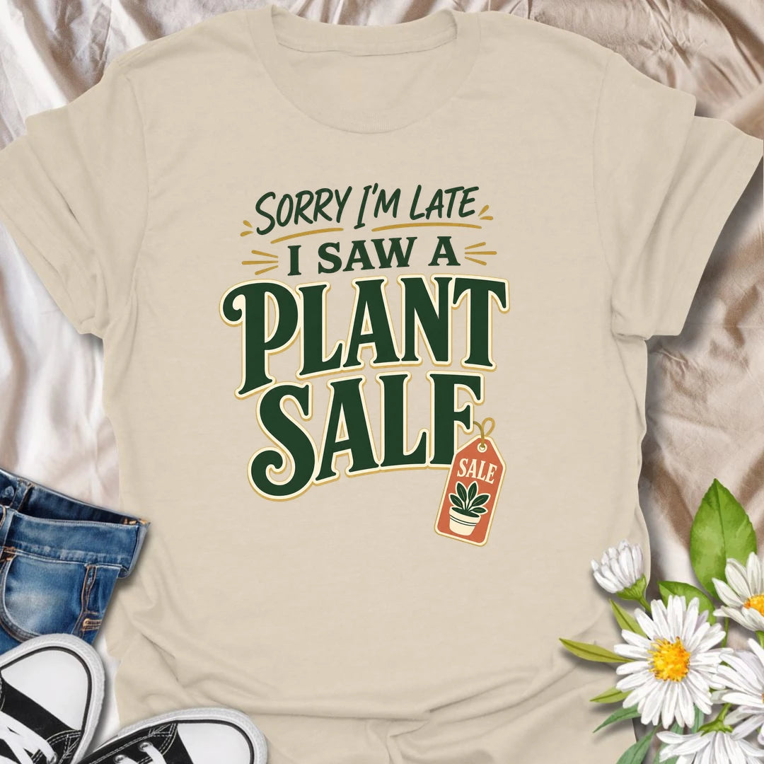 Plant Sale t-shirt for anyone who cannot be trusted around discounted greenery.
The bold retro text and sale tag design make this a funny choice for houseplant shoppers and garden center regulars.
It is perfect for plant moms, plant collectors, and indoor gardeners who are always late because they saw another plant.
A fun gift for plant lovers who know a plant sale is a perfectly valid reason to change plans.