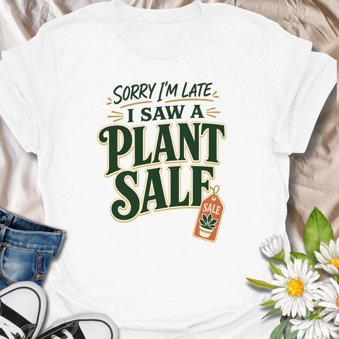 Plant Sale t-shirt for anyone who cannot be trusted around discounted greenery.
The bold retro text and sale tag design make this a funny choice for houseplant shoppers and garden center regulars.
It is perfect for plant moms, plant collectors, and indoor gardeners who are always late because they saw another plant.
A fun gift for plant lovers who know a plant sale is a perfectly valid reason to change plans.