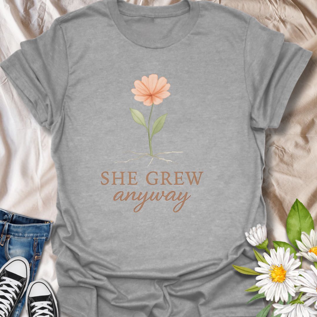 Celebrate resilience and personal growth with the “She Grew Anyway” t-shirt. Featuring a delicate hand-drawn flower with exposed roots, this inspirational design symbolizes strength, healing, and blooming through adversity. Perfect for mental health awareness, self-love, and empowerment, this floral graphic tee makes a meaningful gift for women, plant lovers, and anyone on a journey of growth and self-discovery.