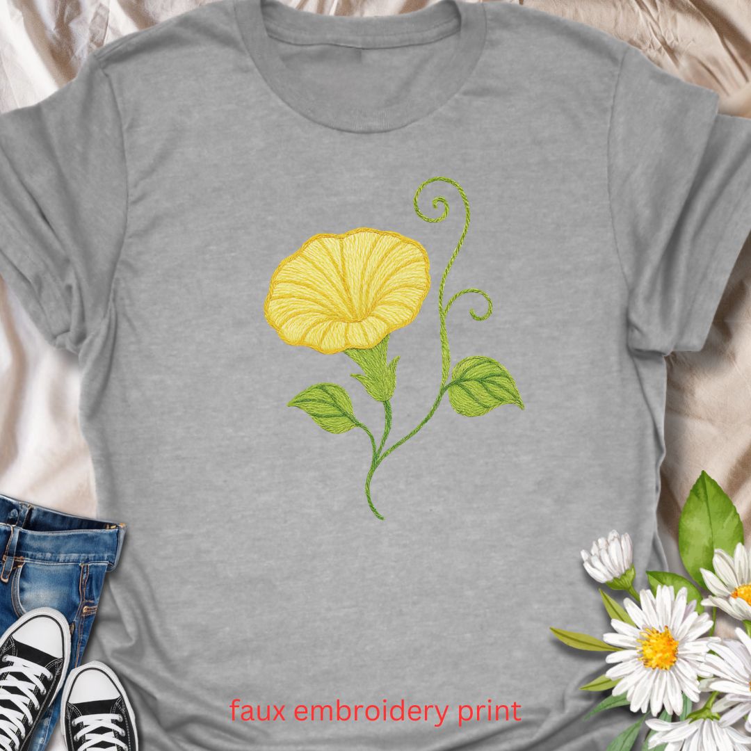 Add a touch of garden charm to your outfit with this faux embroidery t-shirt featuring a delicate yellow morning glory flower. Designed with a stitched-look finish, this nature-inspired tee is perfect for plant lovers, gardeners, and fans of floral simplicity. A soft, botanical vibe for everyday wear or gifting.