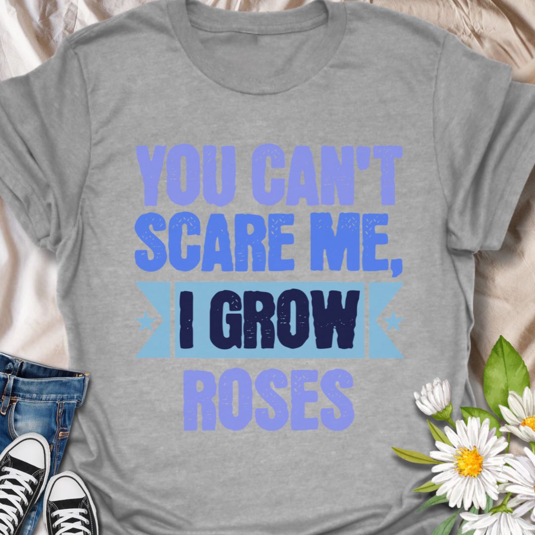 Show off your fearless green thumb with this bold "You Can't Scare Me, I Grow Roses" t-shirt. Designed for confident gardeners and rose enthusiasts who know the thorny truth of growing beauty. A perfect gift for plant lovers who aren’t afraid of a few pricks!