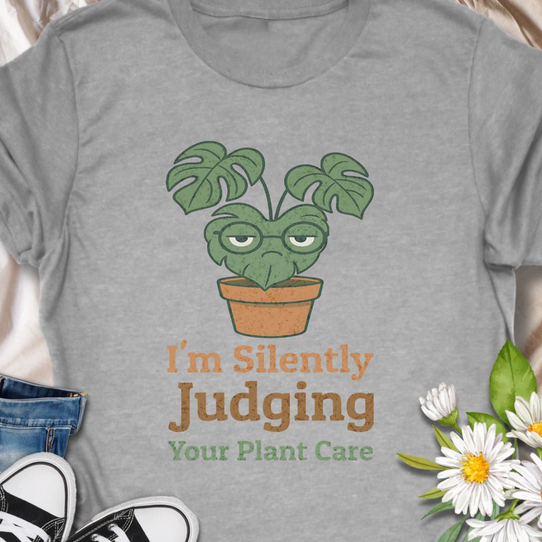 Calling all sassy plant parents – this “I'm Silently Judging Your Plant Care” tee is made for you! Featuring a moody monstera in a pot, it’s perfect for green thumbs who have high standards and a sense of humor. Ideal gift for plant moms, plant dads, and houseplant snobs alike!