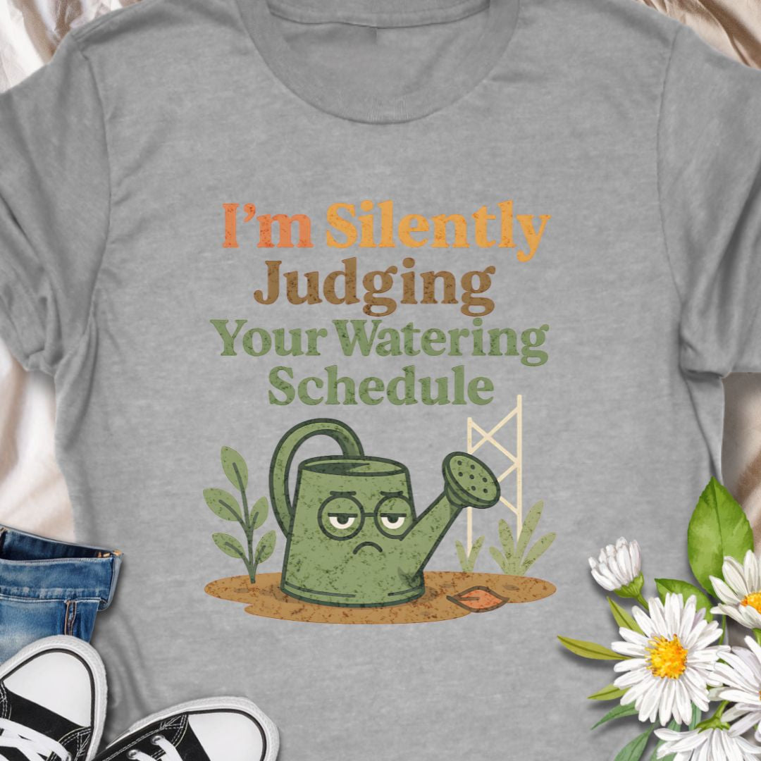 Show off your plant-parent sass with this “I’m Silently Judging Your Watering Schedule” tee featuring a grumpy watering can. A hilarious gift for  moms, dads, grandparents, anyone who enjoys their garden.  This tee shows a love for keeping  leafy friends happy, in a sarcastic way.   Ideal for houseplant lovers and garden geeks alike.