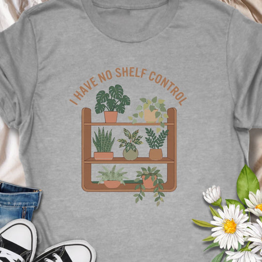 Celebrate your love for plants and witty humor with this “I Have No Shelf Control” t-shirt, featuring a cozy plant shelf filled with greenery. Perfect for houseplant lovers, plant collectors, and green-thumbed decor enthusiasts. A must-have for anyone who keeps adding plants to their shelves—no regrets!