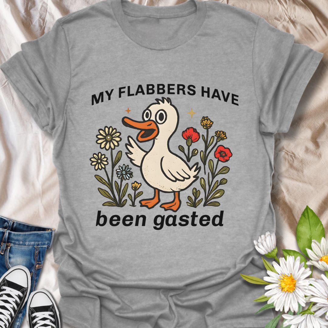 Add a splash of humor to your wardrobe with this quirky “My Flabbers Have Been Gasted” t-shirt featuring an adorable duck and whimsical flowers. A hilarious conversation starter and perfect gift for pun lovers, meme fans, or anyone who appreciates playful and unexpected expressions.