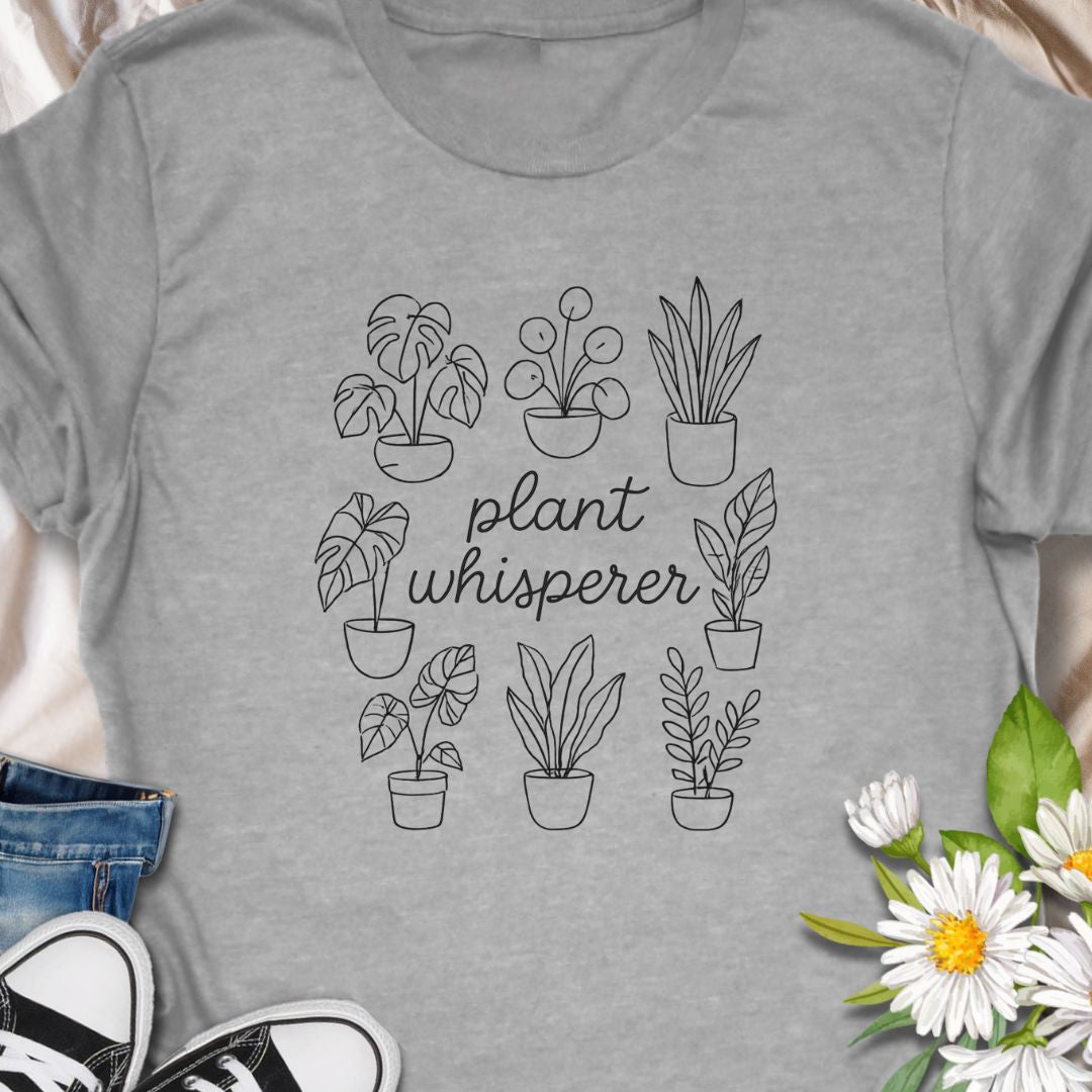 Speak fluent foliage with this "Plant Whisperer" t-shirt – a minimalist, hand-drawn design perfect for indoor plant lovers, proud plant parents, and botanical enthusiasts. A stylish and subtle gift for houseplant collectors and green-thumbed friends.