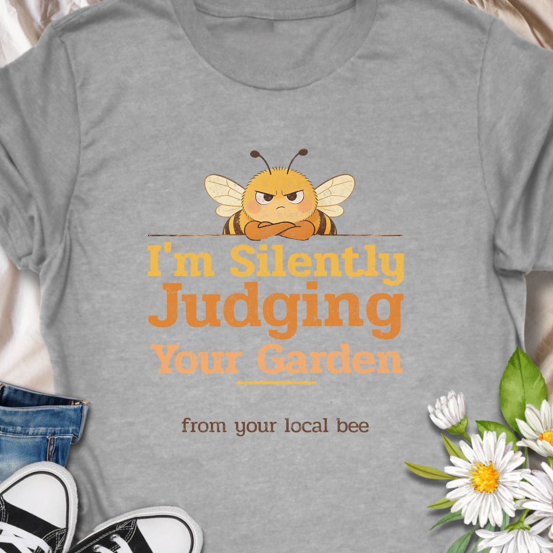 Let your inner bee do the talking with this hilarious “I’m Silently Judging Your Garden” T-shirt featuring a grumpy bee. Perfect for gardeners, plant lovers, and pollinator protectors with a sarcastic sense of humor. A playful gift for bee enthusiasts and backyard botanists alike.
