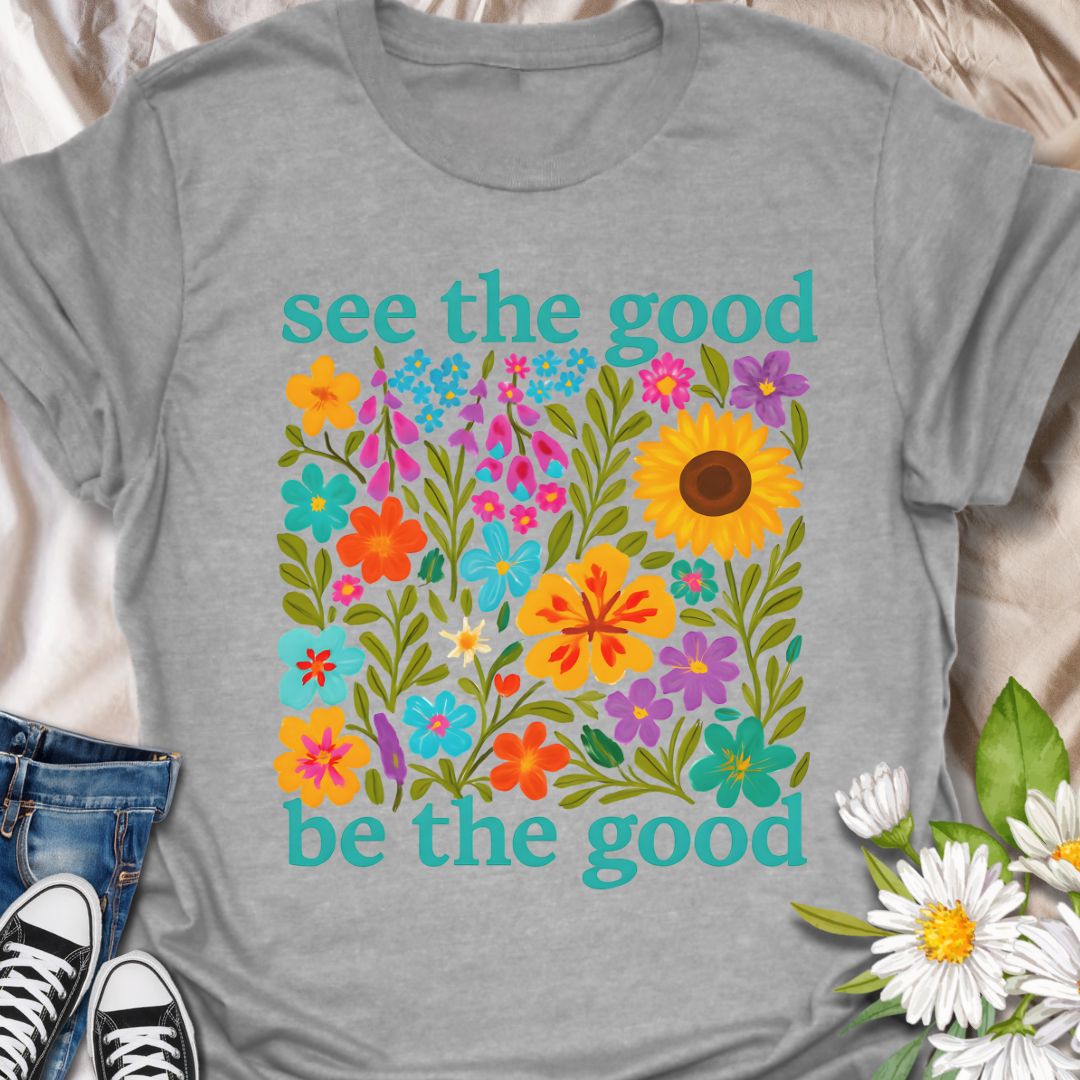 Brighten your day and your outfit with this vibrant floral t-shirt featuring the inspiring message: "See the good, be the good." Perfect for garden lovers, positivity seekers, and anyone who believes in spreading kindness. A cheerful and meaningful gift for plant moms, flower fans, and happy souls alike.