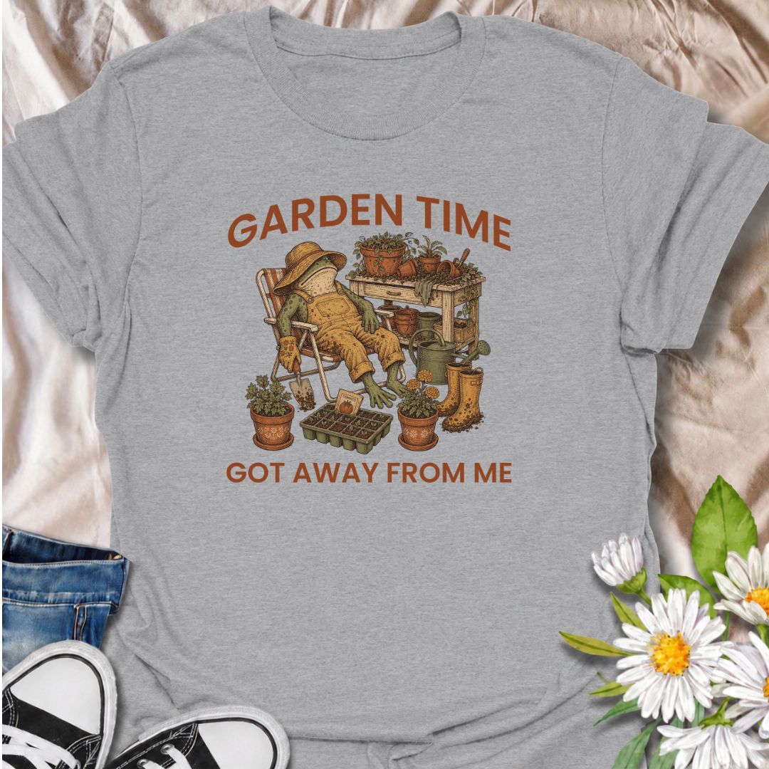 Celebrate losing track of time in the garden with this funny “Garden Time Got Away From Me” T-shirt. Featuring a relaxed frog surrounded by pots, seedlings, gardening tools, and muddy boots, it perfectly captures an afternoon that turned into an all-day garden session. A charming gift for gardeners, plant lovers, and anyone happiest pottering outdoors.