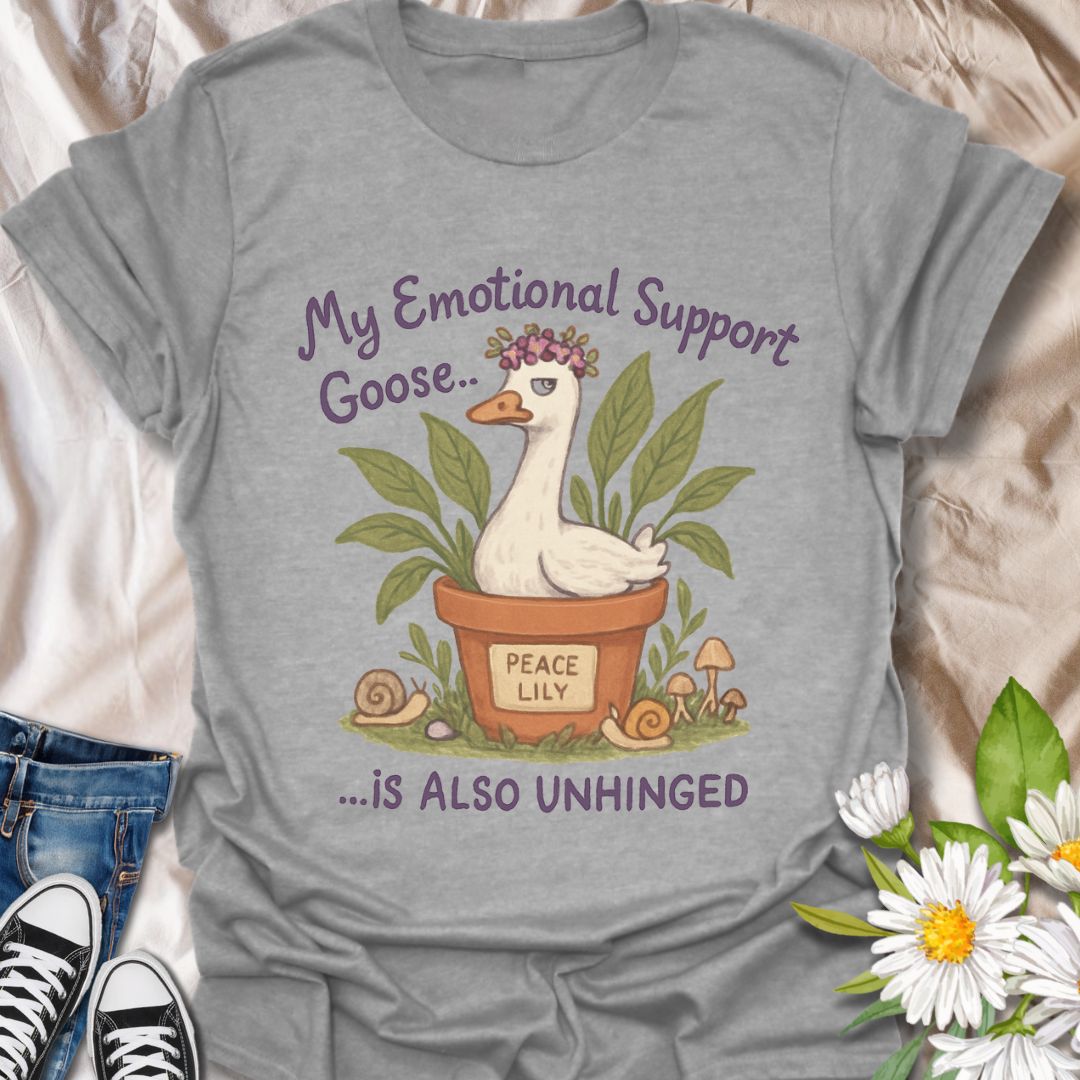 Hilarious and quirky t-shirt featuring a peace lily plant pot and an unhinged “emotional support goose.” This fun design is perfect for plant lovers, mental health warriors, and anyone with a wild sense of humor. A unique gift for gardeners and goose enthusiasts alike!