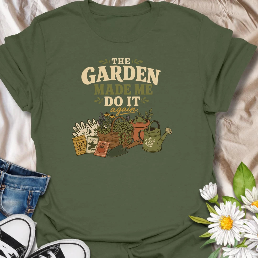 Blame the garden with this playful “The Garden Made Me Do It Again” T-shirt. Featuring gardening gloves, seed packets, a flower basket, watering can, and a curious frog, it captures the irresistible pull of another garden project. A fun choice for gardeners, plant lovers, and enthusiastic seed shoppers.