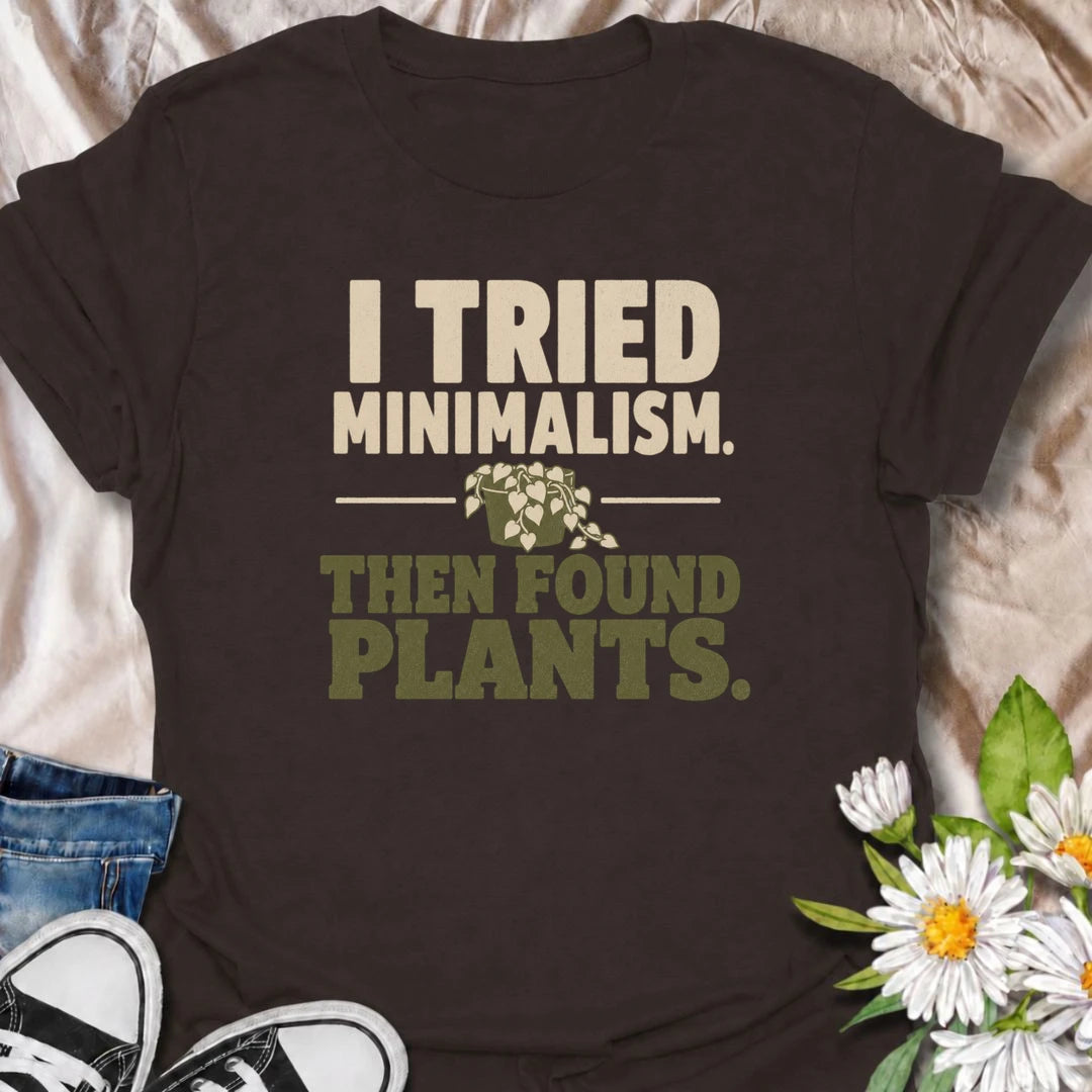 A funny plant T-shirt for anyone who tried to embrace minimalism and immediately got distracted by houseplants. The phrase “I Tried Minimalism. Then Found Plants.” is perfect for plant collectors, indoor gardeners, and anyone whose shelves somehow keep getting greener. It makes a great gift for houseplant lovers with a dry sense of humor and very little empty space left at home. A simple, bold botanical design that works especially well for everyday casual wear. Ideal for plant parents, pothos fans, and pro