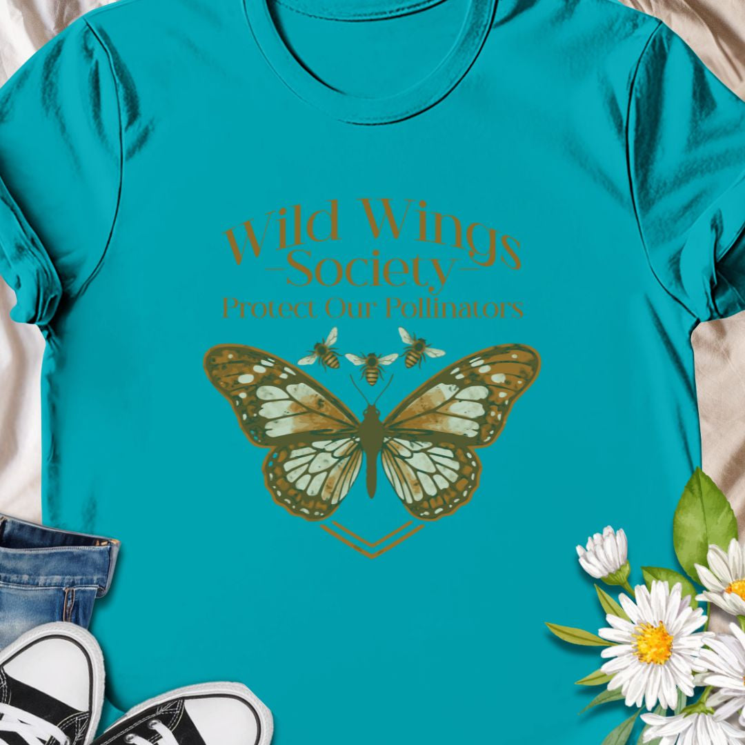 Butterfly conservation themed shirt with 'Wild Wings Society' design. Great for nature lovers and pollinator protectors.   Soft, worn-in comfort meets quiet activism - a warm-toned monarch rests at the center of a vintage-inspired crest, with the words “Wild Wings Society — Protect Our Pollinators” arched above. 