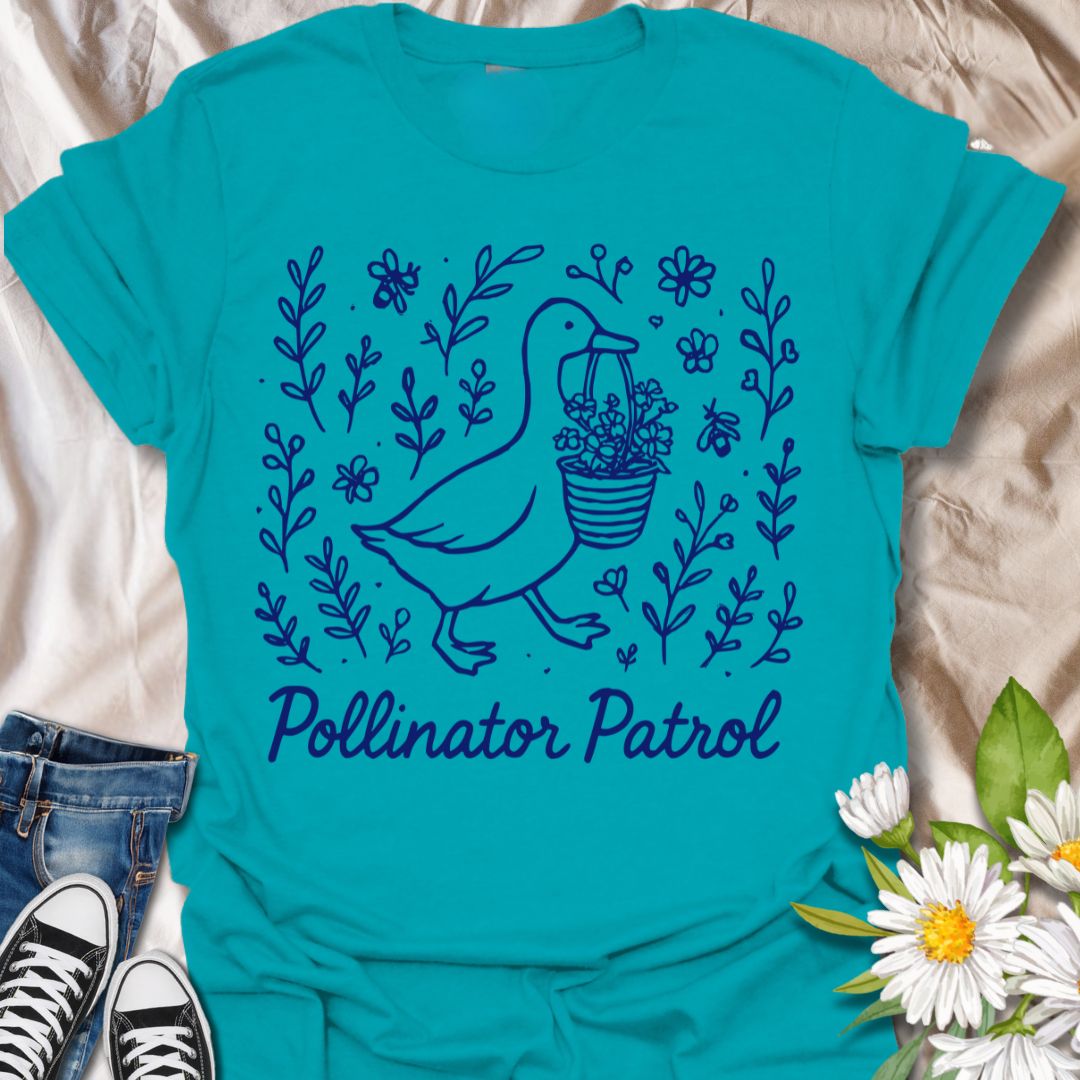 Charming ‘Pollinator Patrol’ goose shirt featuring a goose carrying flowers surrounded by bees and blooms. Perfect for gardeners, beekeepers, and wildlife conservation enthusiasts