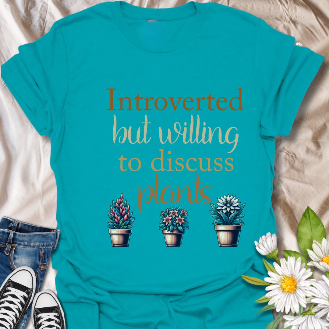 Show off your quiet nature and leafy passions with this “Introverted but Willing to Discuss Plants” t-shirt. Featuring charming potted plants and playful fonts, it’s perfect for plant lovers who prefer petals over people.