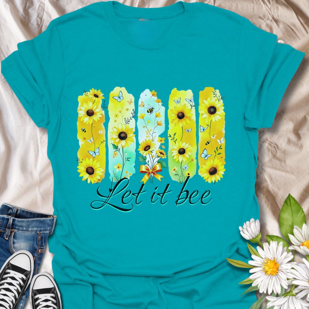 Bright sunflower t-shirt with bees and butterflies and the playful phrase "Let it bee." Perfect for nature lovers, bee enthusiasts, gardeners, and wildflower fans who appreciate pollinators. Fun spring and summer tee celebrating positivity and nature’s beauty. Tropical blue