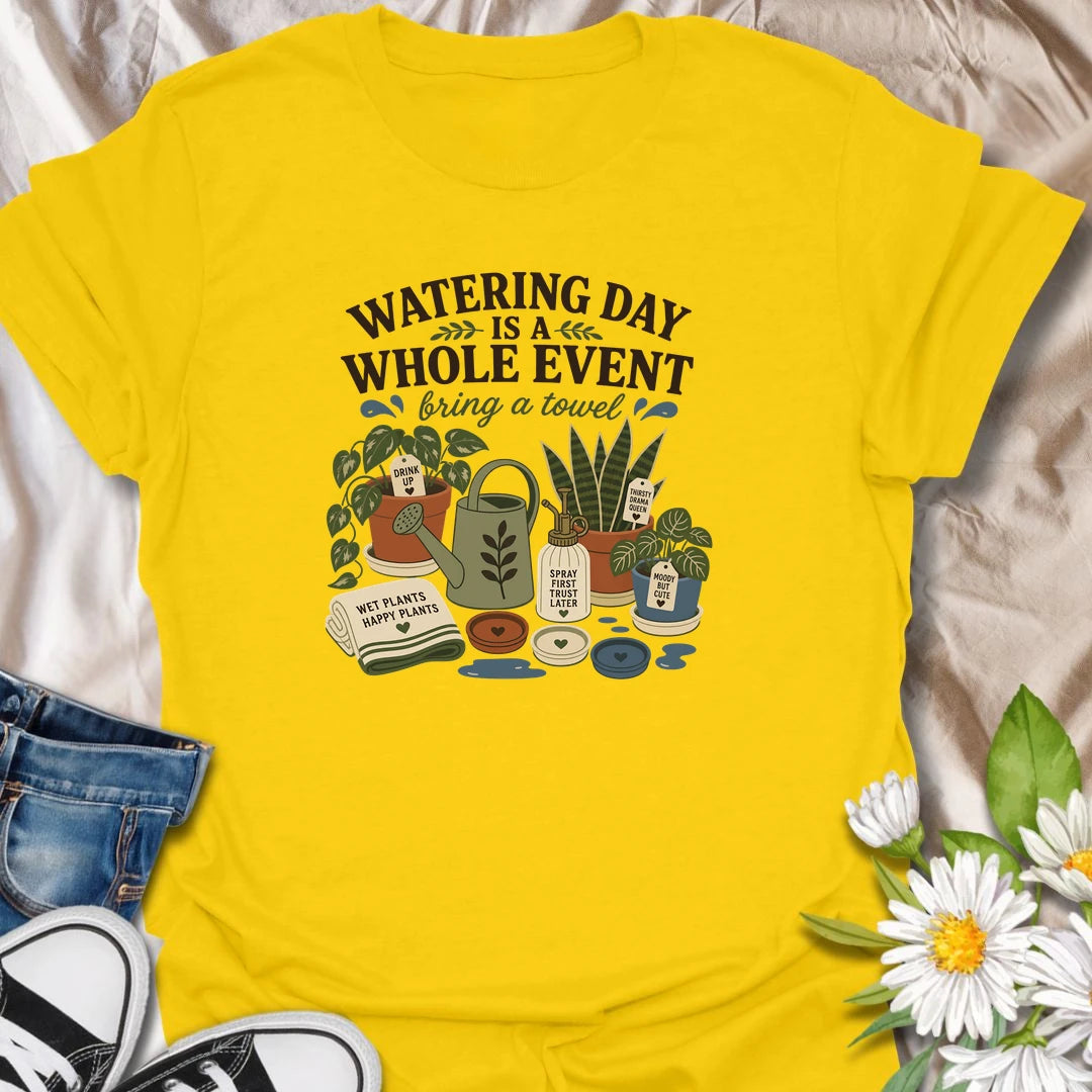 Celebrate the weekly houseplant ritual with this “Watering Day Is a Whole Event” T-shirt. Featuring thirsty plants, watering tools, saucers, and the reminder to bring a towel, it perfectly captures the organized chaos of plant care. A funny gift for indoor gardeners with an extensive watering routine.