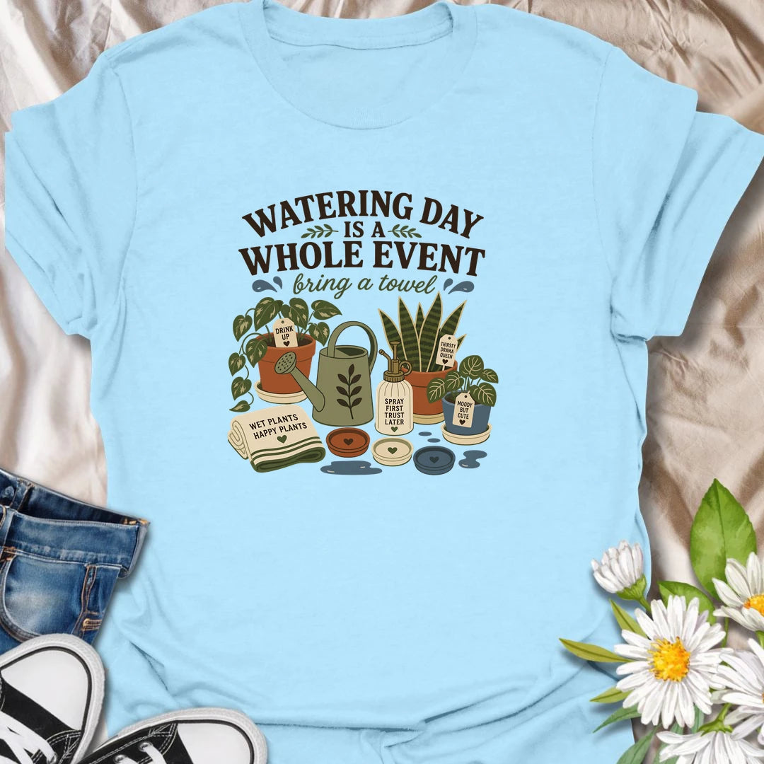 Celebrate the weekly houseplant ritual with this “Watering Day Is a Whole Event” T-shirt. Featuring thirsty plants, watering tools, saucers, and the reminder to bring a towel, it perfectly captures the organized chaos of plant care. A funny gift for indoor gardeners with an extensive watering routine.