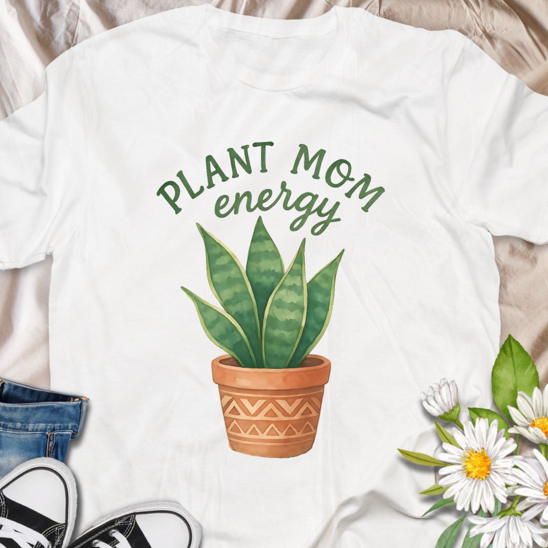 Show off your green thumb with this stylish “Plant Mom Energy” t-shirt featuring a beautiful snake plant in a terracotta pot. Perfect for indoor gardeners and houseplant lovers, this tee radiates nurturing vibes and earthy style. A cozy, cute wardrobe essential for any proud plant mom!