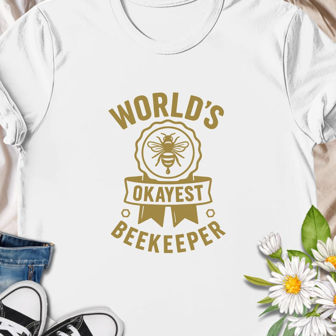 Celebrate your love for beekeeping with a humorous twist in this "World's Okayest Beekeeper" T-Shirt. Perfect for backyard beekeepers, honey lovers, and bee enthusiasts who know it's not about perfection—it's about passion. Makes a great gift for bee dads, moms, hobbyists, and anyone who keeps buzzing through life.